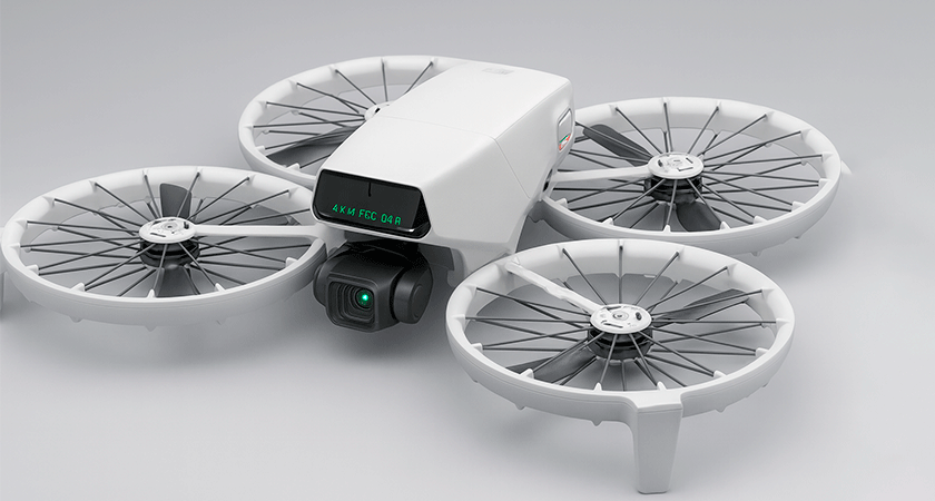Квадрокоптер DJI Flip с защитными кольцами на пропеллерах и камерой высокого разрешения, вид сбоку